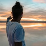 man in white crew neck t-shirt wearing black sunglasses