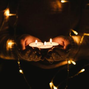selective focus photography of three lit tealight candles